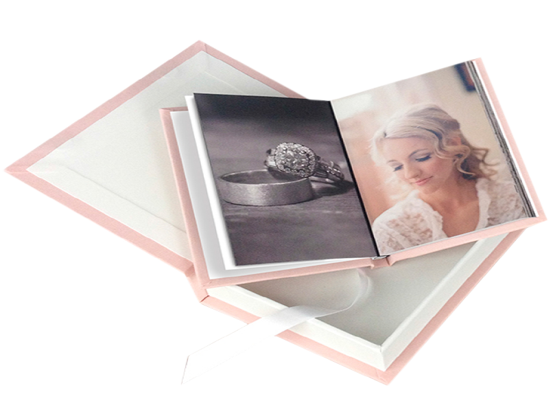 Pink fabric wedding photo open & laying on a matching pink fabric book box