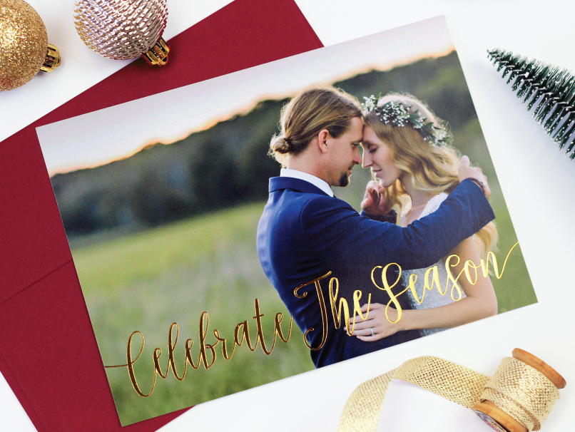 Bride & Groom in loving embrace in a field printed on a flat holiday foil card